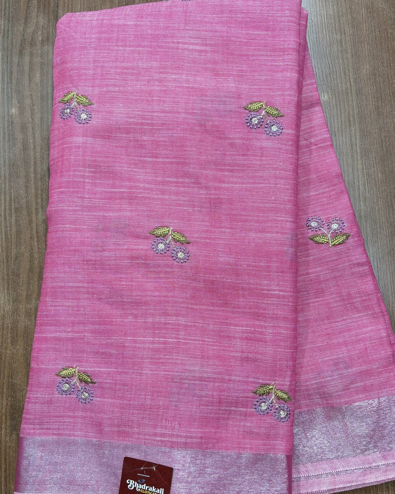 Rose pink linen saree with silver zari border