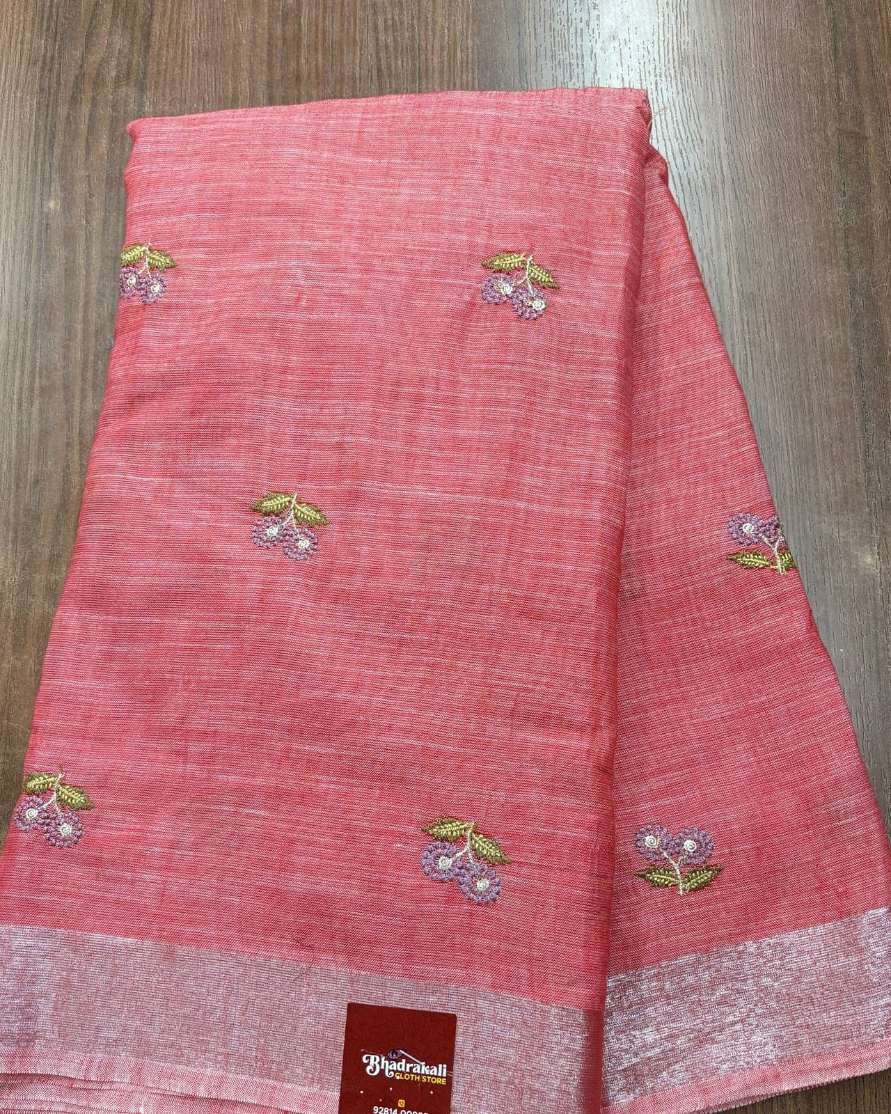 Coral linen saree with silver zari border