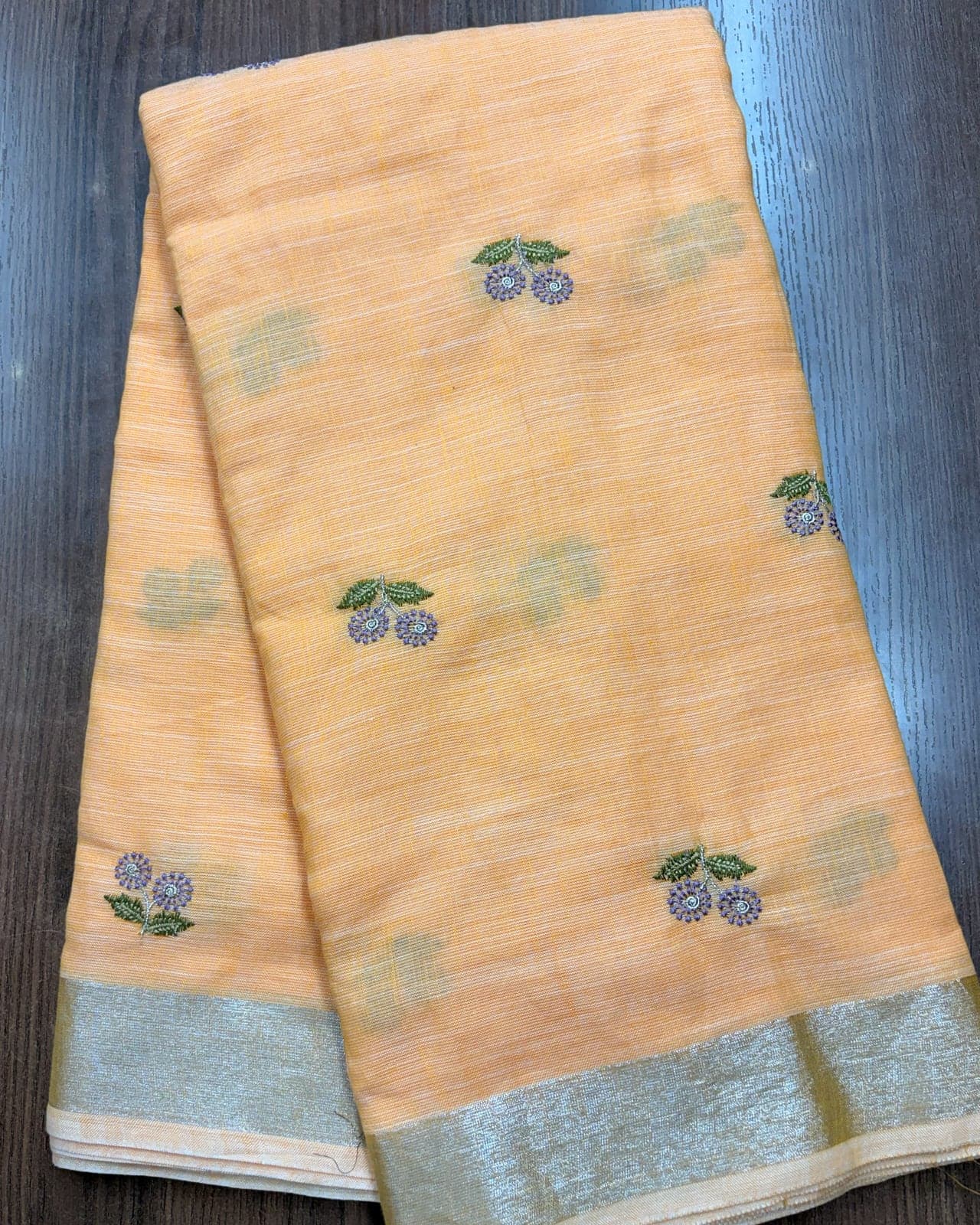 Apricot linen saree with silver zari border